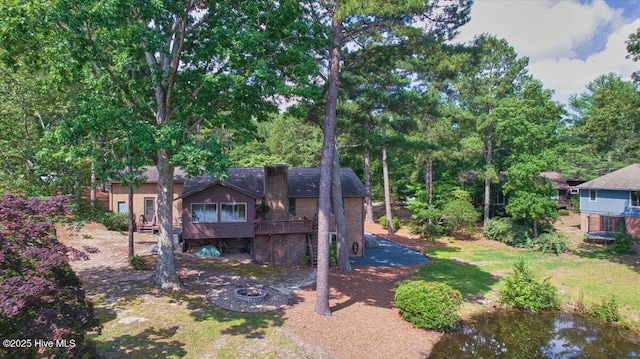 120 Shagbark Ct, Seven Lakes, NC 27376 - rear view of property with a deck and an outdoor fire pit