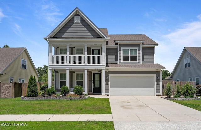 1035 Bent Blade Ln, Wilmington, NC 28411 - view of front facade with a balcony, an attached garage, driveway, roof with shingles, and covered porch