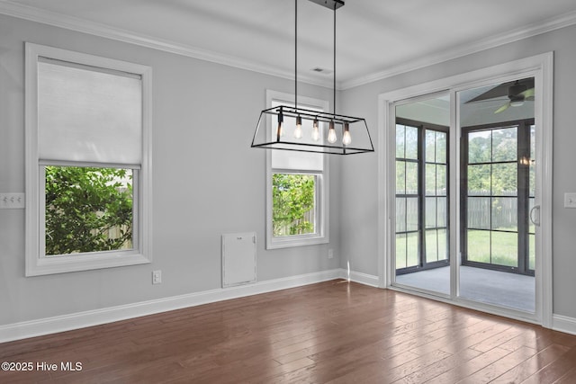 1035 Bent Blade Ln, Wilmington, NC 28411 - unfurnished dining area with plenty of natural light, dark wood-type flooring, crown molding, and ceiling fan