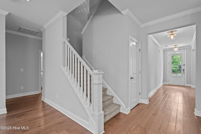 1035 Bent Blade Ln, Wilmington, NC 28411 - foyer with hardwood / wood-style flooring, crown molding, and stairs