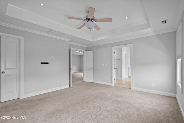 1035 Bent Blade Ln, Wilmington, NC 28411 - unfurnished bedroom with a tray ceiling, light carpet, crown molding, and recessed lighting