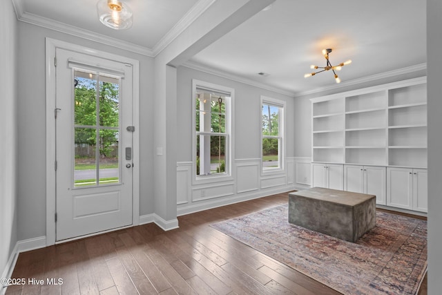 1035 Bent Blade Ln, Wilmington, NC 28411 - foyer featuring a chandelier, dark wood-style floors, and ornamental molding