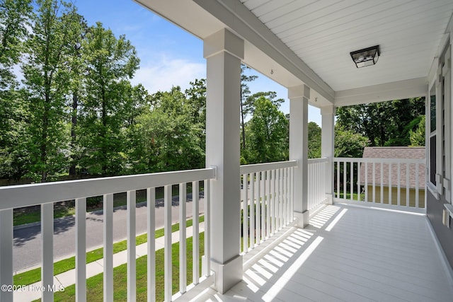 1035 Bent Blade Ln, Wilmington, NC 28411 - covered porch featuring view of wooded area
