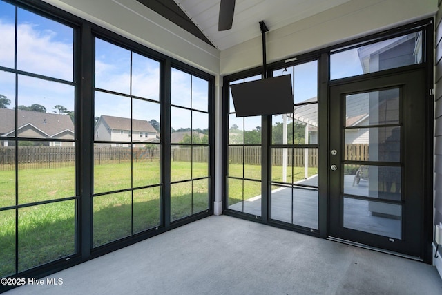 1035 Bent Blade Ln, Wilmington, NC 28411 - unfurnished sunroom with a ceiling fan, lofted ceiling, and a residential view