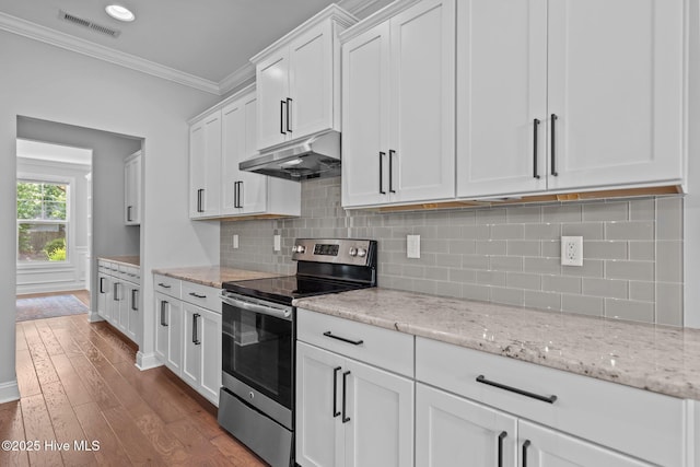 1035 Bent Blade Ln, Wilmington, NC 28411 - kitchen with stainless steel range with electric cooktop, under cabinet range hood, ornamental molding, white cabinets, and dark wood-style flooring
