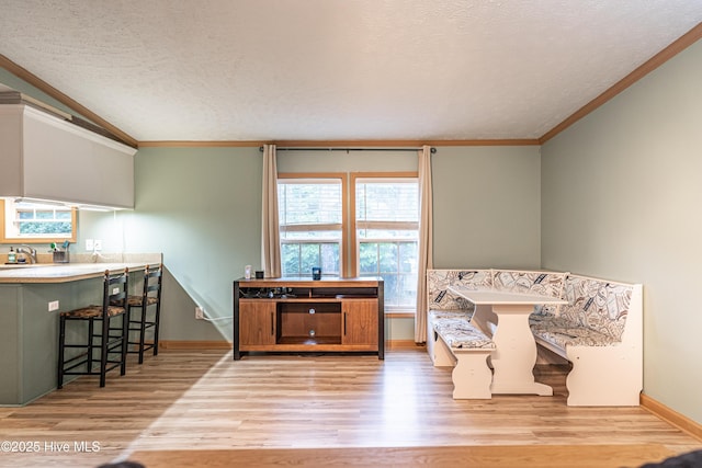 1360 Rays Bridge Rd, Whispering Pines, NC 28327 - living area featuring wood finished floors, a textured ceiling, lofted ceiling, and crown molding