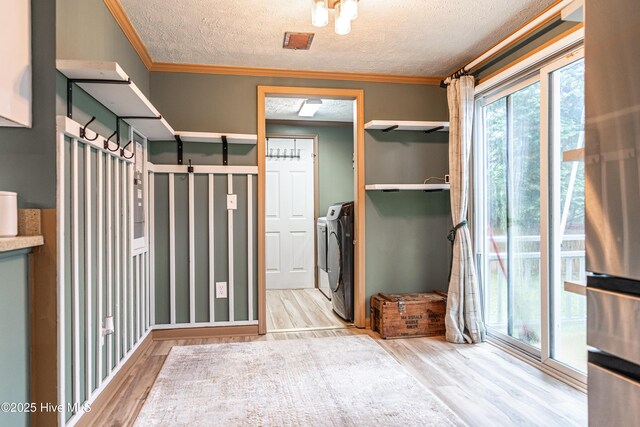 1360 Rays Bridge Rd, Whispering Pines, NC 28327 - interior space with separate washer and dryer, wood finished floors, a textured ceiling, and ornamental molding
