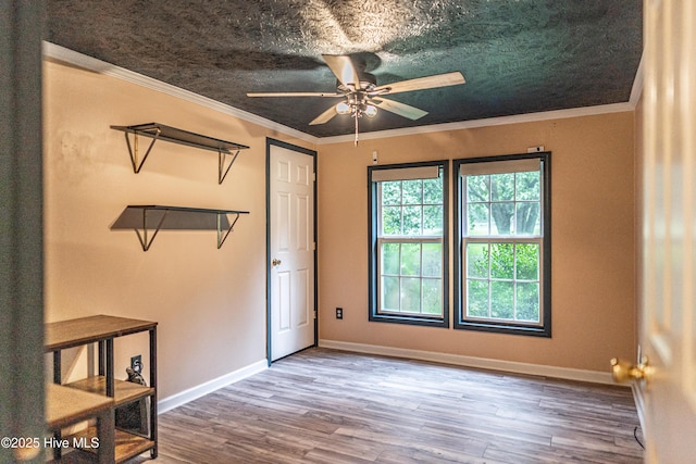 1360 Rays Bridge Rd, Whispering Pines, NC 28327 - empty room with ceiling fan, wood finished floors, and ornamental molding