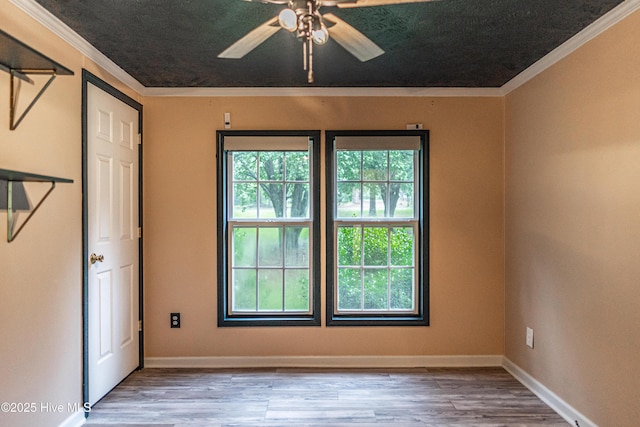 1360 Rays Bridge Rd, Whispering Pines, NC 28327 - unfurnished bedroom featuring crown molding, wood finished floors, and a ceiling fan