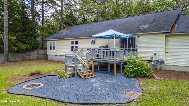 1360 Rays Bridge Rd, Whispering Pines, NC 28327 - rear view of house with crawl space, a wooden deck, roof with shingles, an outdoor fire pit, and stairs