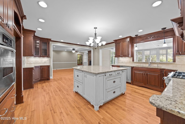 1909 Pawnee Dr, Kinston, NC 28504 - kitchen featuring recessed lighting, ceiling fan, decorative backsplash, stainless steel appliances, and a chandelier