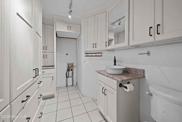 1909 Pawnee Dr, Kinston, NC 28504 - bathroom featuring vanity, rail lighting, and tile patterned floors