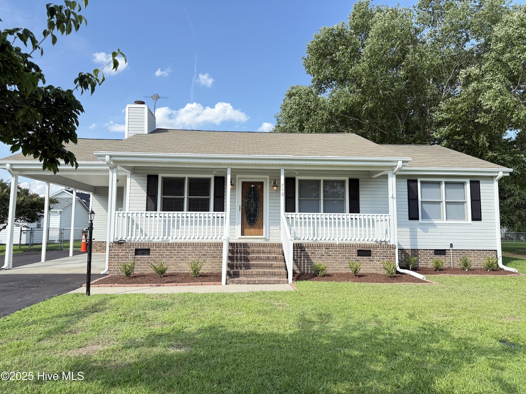 716 Mill Branch Rd, Sharpsburg, NC 27803 - view of front of property with crawl space, a porch, a carport, and a chimney