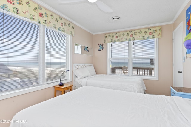 2101 Ocean Dr Unit A, Emerald Isle, NC 28594 - bedroom featuring ornamental molding and a ceiling fan