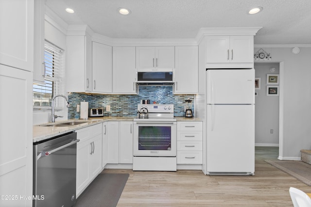 2101 Ocean Dr Unit A, Emerald Isle, NC 28594 - kitchen featuring white appliances, white cabinetry, backsplash, light stone counters, and recessed lighting