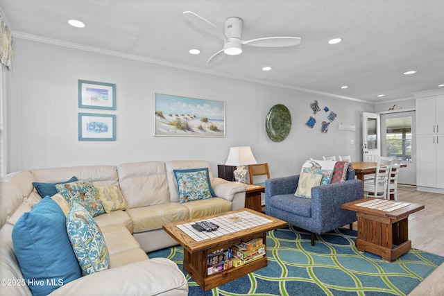 2101 Ocean Dr Unit A, Emerald Isle, NC 28594 - living area featuring wood finished floors, ornamental molding, a ceiling fan, and recessed lighting