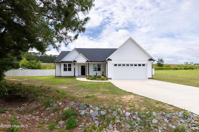 6001 Farmwood Loop, Wilson, NC 27896 - modern farmhouse with a garage, driveway, and a shingled roof