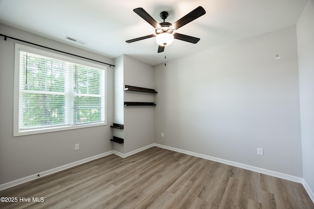 6001 Farmwood Loop, Wilson, NC 27896 - spare room featuring wood finished floors and ceiling fan