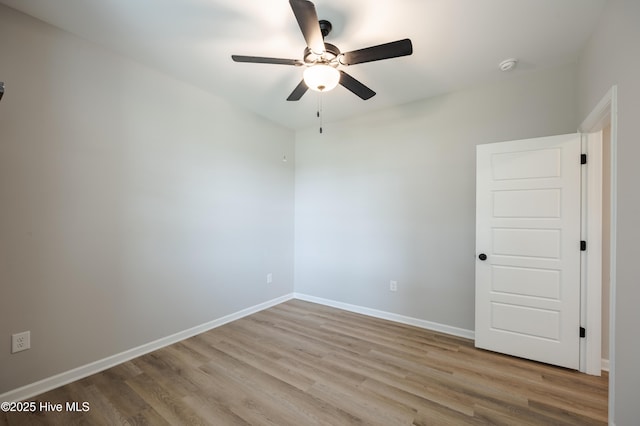 6001 Farmwood Loop, Wilson, NC 27896 - empty room featuring a ceiling fan, wood finished floors, and a smoke detector