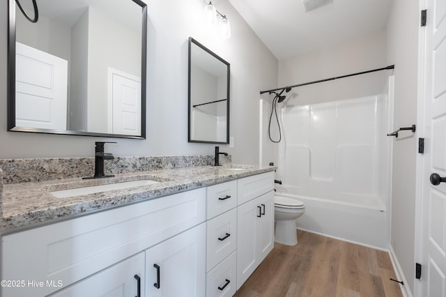 6001 Farmwood Loop, Wilson, NC 27896 - bathroom with wood finished floors, double vanity, and tub / shower combination