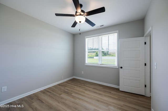 6001 Farmwood Loop, Wilson, NC 27896 - unfurnished room featuring wood finished floors and a ceiling fan