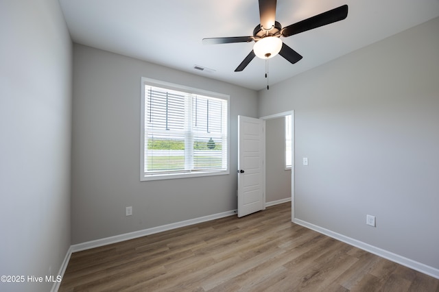 6001 Farmwood Loop, Wilson, NC 27896 - unfurnished room with wood finished floors and ceiling fan