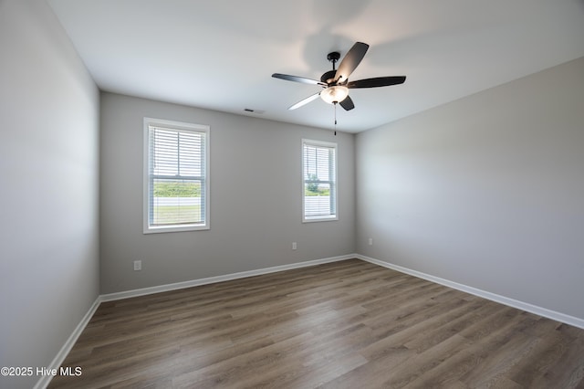 6001 Farmwood Loop, Wilson, NC 27896 - empty room with ceiling fan and wood finished floors