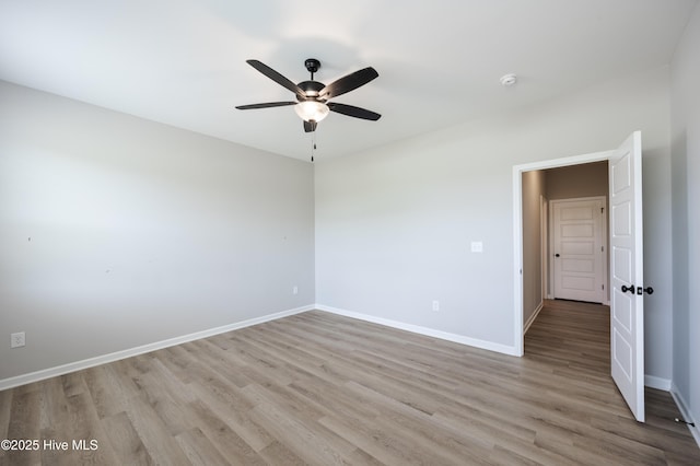 6001 Farmwood Loop, Wilson, NC 27896 - unfurnished room featuring light wood-style floors, a ceiling fan, and a smoke detector