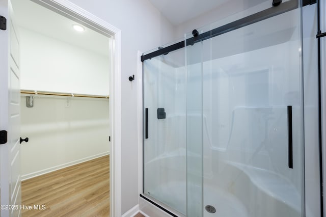 6001 Farmwood Loop, Wilson, NC 27896 - full bathroom with wood finished floors, a shower stall, and a spacious closet