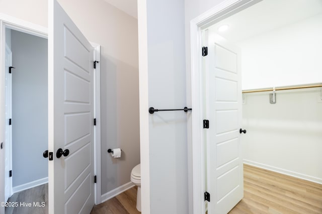 6001 Farmwood Loop, Wilson, NC 27896 - bathroom with wood finished floors and toilet