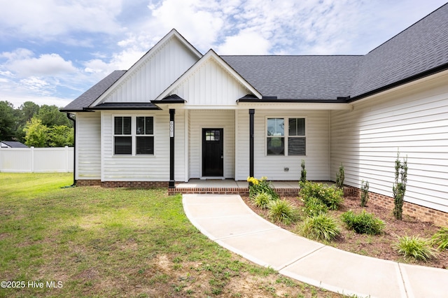 6001 Farmwood Loop, Wilson, NC 27896 - view of front of property featuring a porch, board and batten siding, and roof with shingles