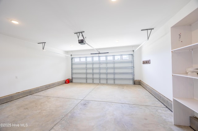 6001 Farmwood Loop, Wilson, NC 27896 - garage with a garage door opener and baseboards