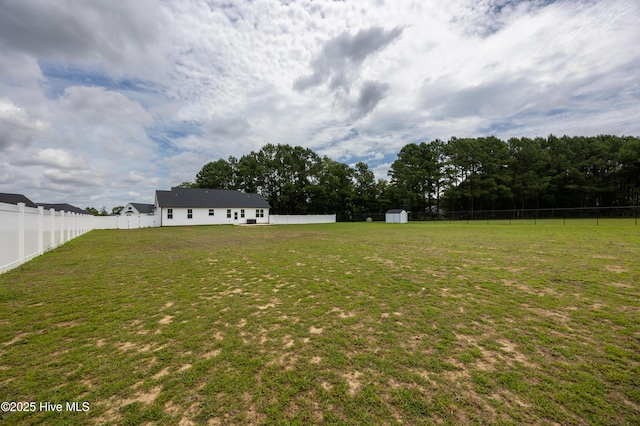 6001 Farmwood Loop, Wilson, NC 27896 - fenced backyard featuring a storage unit