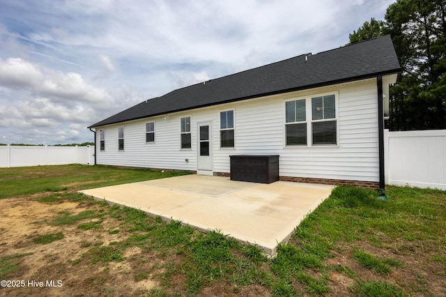 6001 Farmwood Loop, Wilson, NC 27896 - back of house with a patio area and roof with shingles