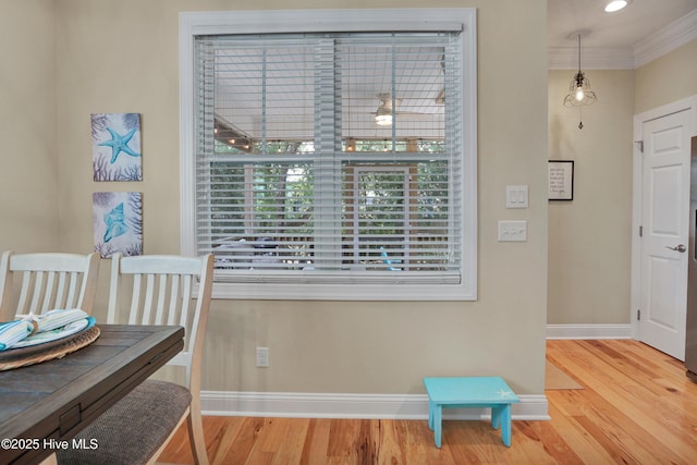 215 NE 54th St, Oak Island, NC 28465 - dining space with wood finished floors and ornamental molding
