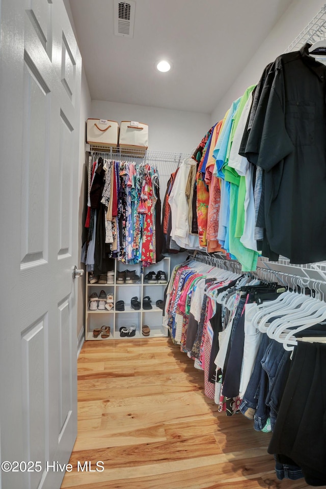 215 NE 54th St, Oak Island, NC 28465 - walk in closet with wood finished floors