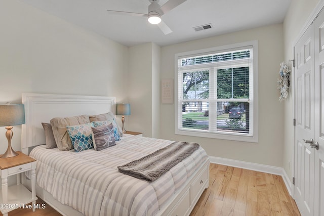215 NE 54th St, Oak Island, NC 28465 - bedroom with light wood finished floors and a ceiling fan