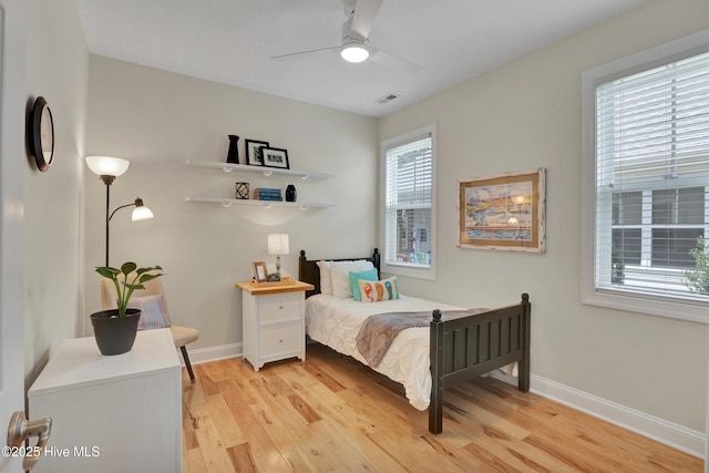 215 NE 54th St, Oak Island, NC 28465 - bedroom featuring light wood-style floors and a ceiling fan