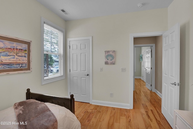215 NE 54th St, Oak Island, NC 28465 - bedroom featuring light wood finished floors and baseboards