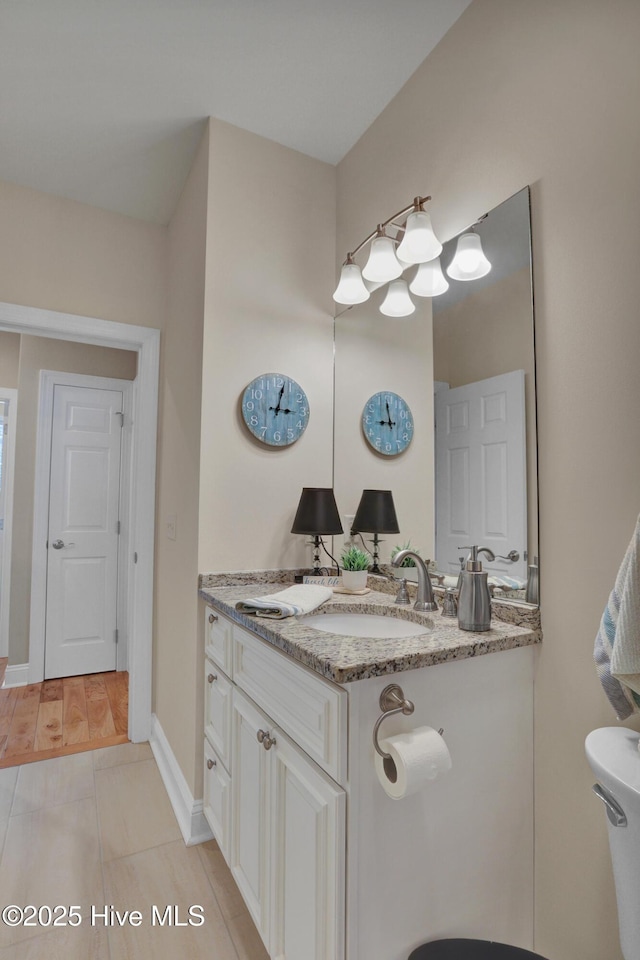 215 NE 54th St, Oak Island, NC 28465 - bathroom featuring double vanity and toilet