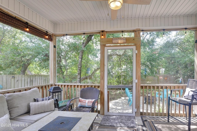 215 NE 54th St, Oak Island, NC 28465 - sunroom / solarium featuring a ceiling fan