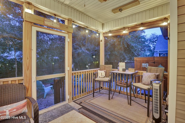 215 NE 54th St, Oak Island, NC 28465 - sunroom / solarium featuring ceiling fan
