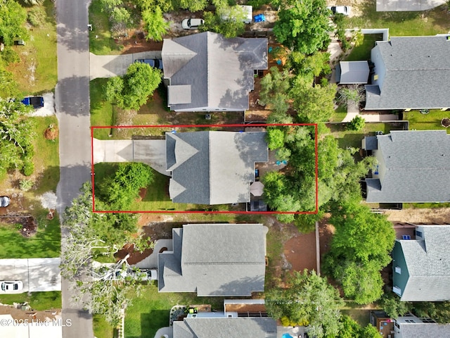 215 NE 54th St, Oak Island, NC 28465 - aerial perspective of suburban area featuring property boundaries highlighted