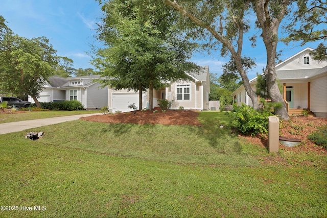 215 NE 54th St, Oak Island, NC 28465 - view of front facade featuring a garage, driveway, and a front lawn