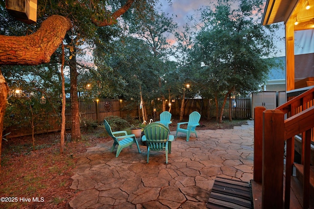 215 NE 54th St, Oak Island, NC 28465 - fenced backyard featuring a patio