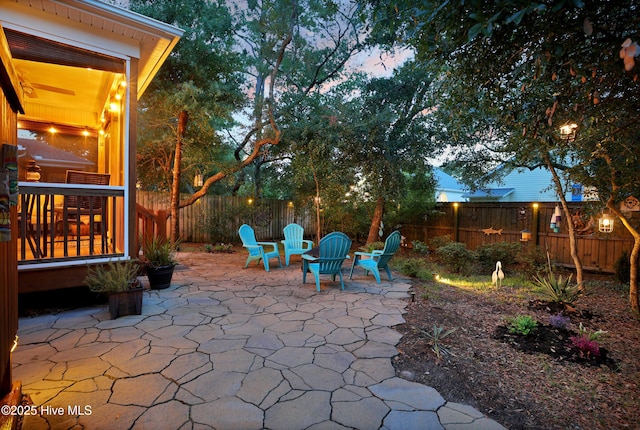 215 NE 54th St, Oak Island, NC 28465 - fenced backyard featuring a patio area