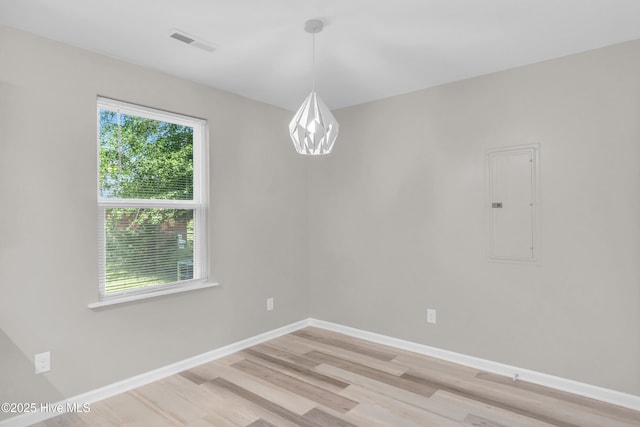 1004 S 8th St, Wilmington, NC 28401 - unfurnished room featuring electric panel and light wood-style floors