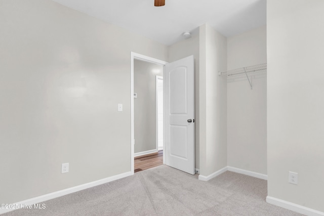 1004 S 8th St, Wilmington, NC 28401 - unfurnished bedroom with carpet, a closet, and a ceiling fan