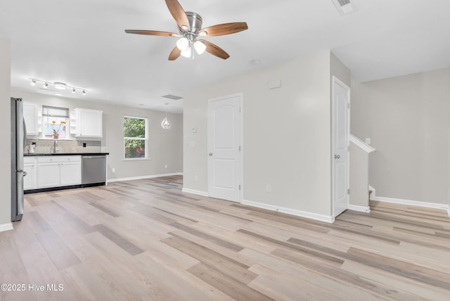 1004 S 8th St, Wilmington, NC 28401 - unfurnished living room featuring a ceiling fan and light wood-style flooring