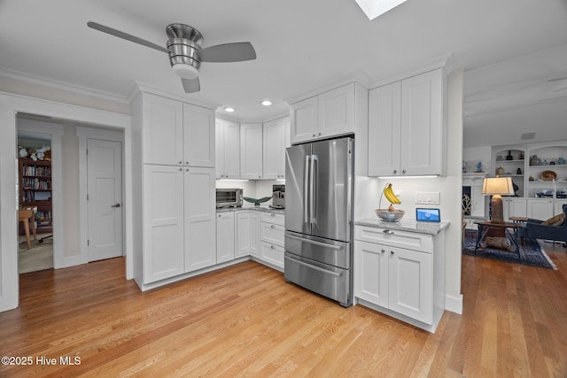 110 Mariners Ct, New Bern, NC 28562 - kitchen featuring appliances with stainless steel finishes, ceiling fan, white cabinets, recessed lighting, and light wood-style floors